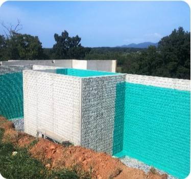 Stone foundation wall coated with Rub-R-Wall membrane